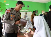 Kabag Ops Polres Tanggamus Hadiri Penyaluran Perdana MBG di SMAN 2 Kota Agung
