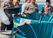 Dukung Ketahanan Pangan Nasional, Kapolsek Kumpeh Ulu Hadiri Penebaran Benih Ikan Nila BUMDes Kasang Lopak Alai